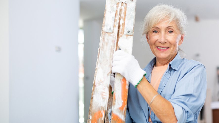 Woman holding a ladder