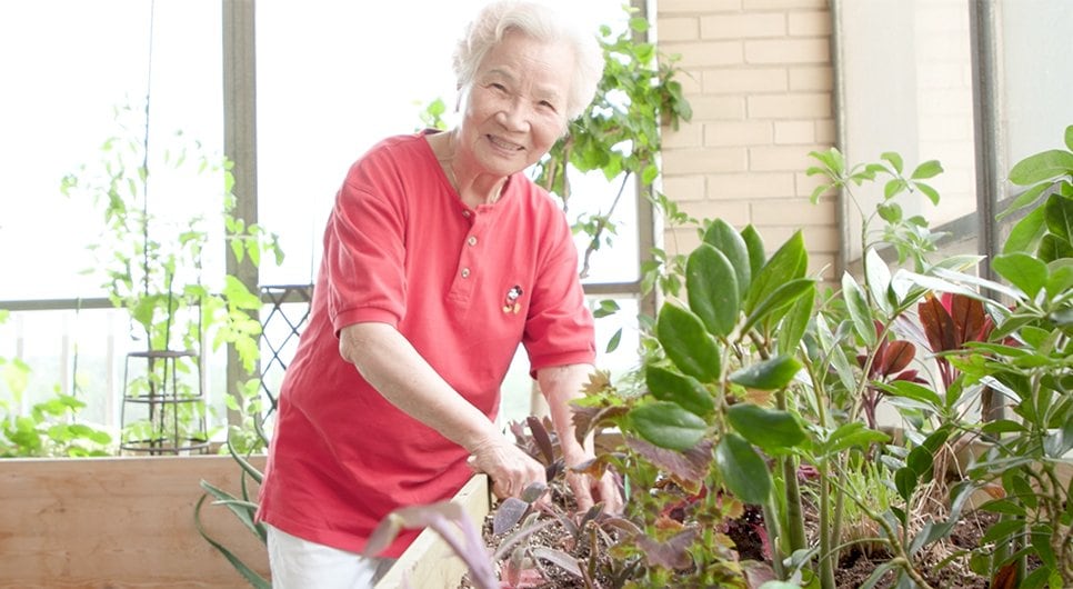 Woman Gardening on porch at Bergen New Bridge Medical Center