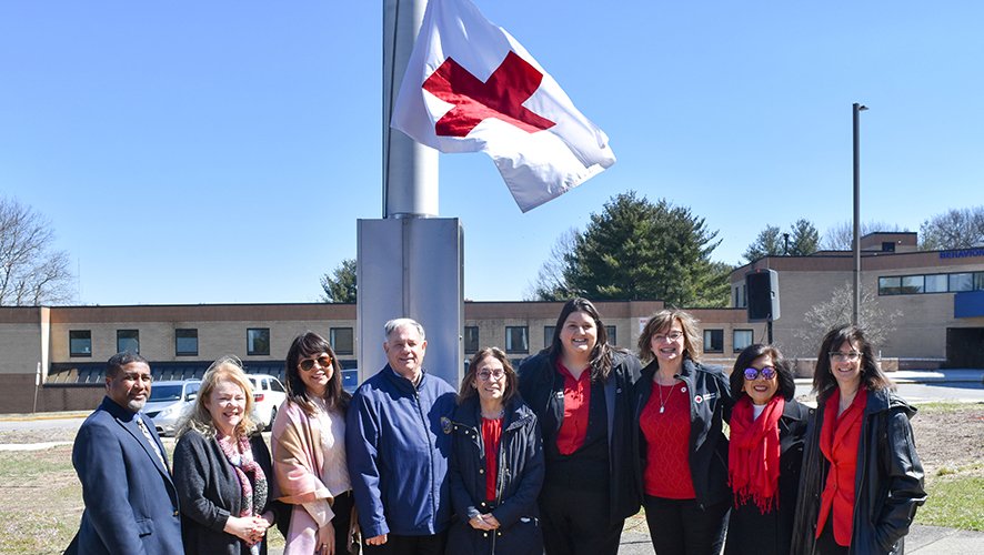 red cross flag raising